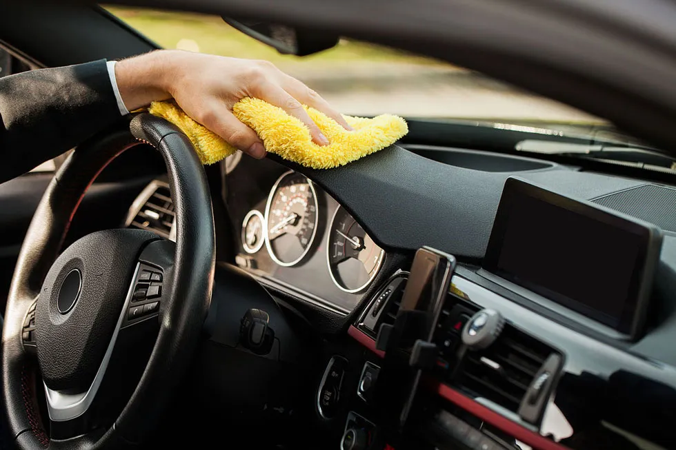 cleaning-car-hand-with-yellow-microfiber-cloth-cleaning-car-interior